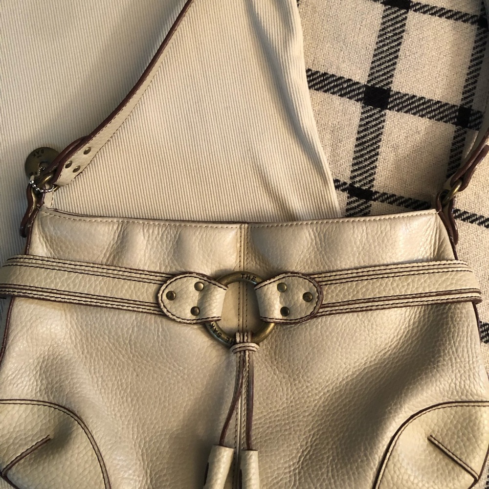 The Sak brand Leather Hobo Bag in Cream with Brass Ring Accent